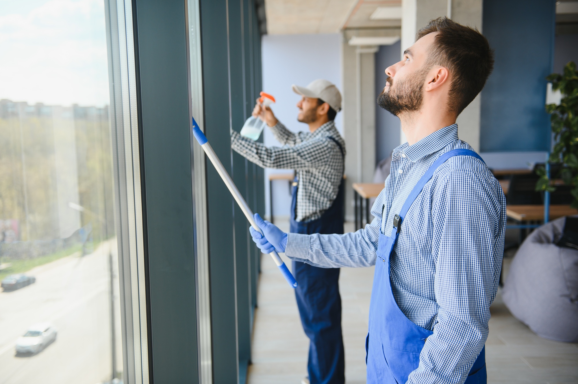 A man cleaning windows. cleaning team of men washes the windows